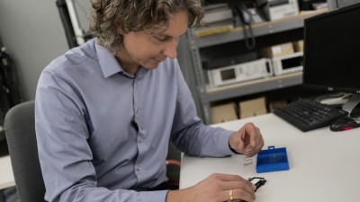 man examining microscope slides