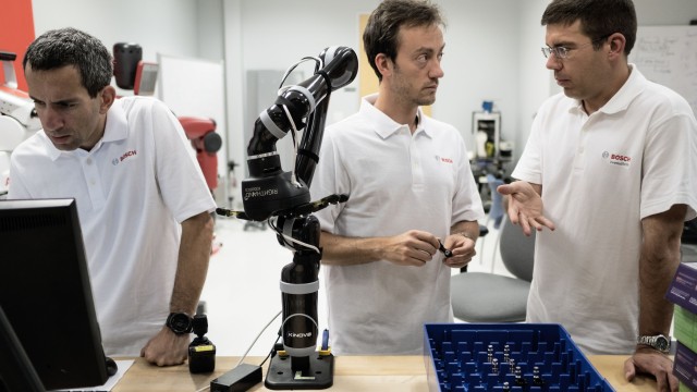 men working on robot