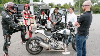 ARCH motorcycle and Bosch Team discussing ABS around a motorcycle