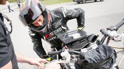 Person pointing at ABS on a KRGT-1 motorcycle