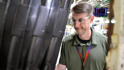 Mike Kugler inspecting parts