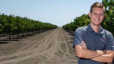 Andreas Fuchs posing in California vineyard.