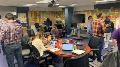 Hackathon participants working to categorize UX findings.